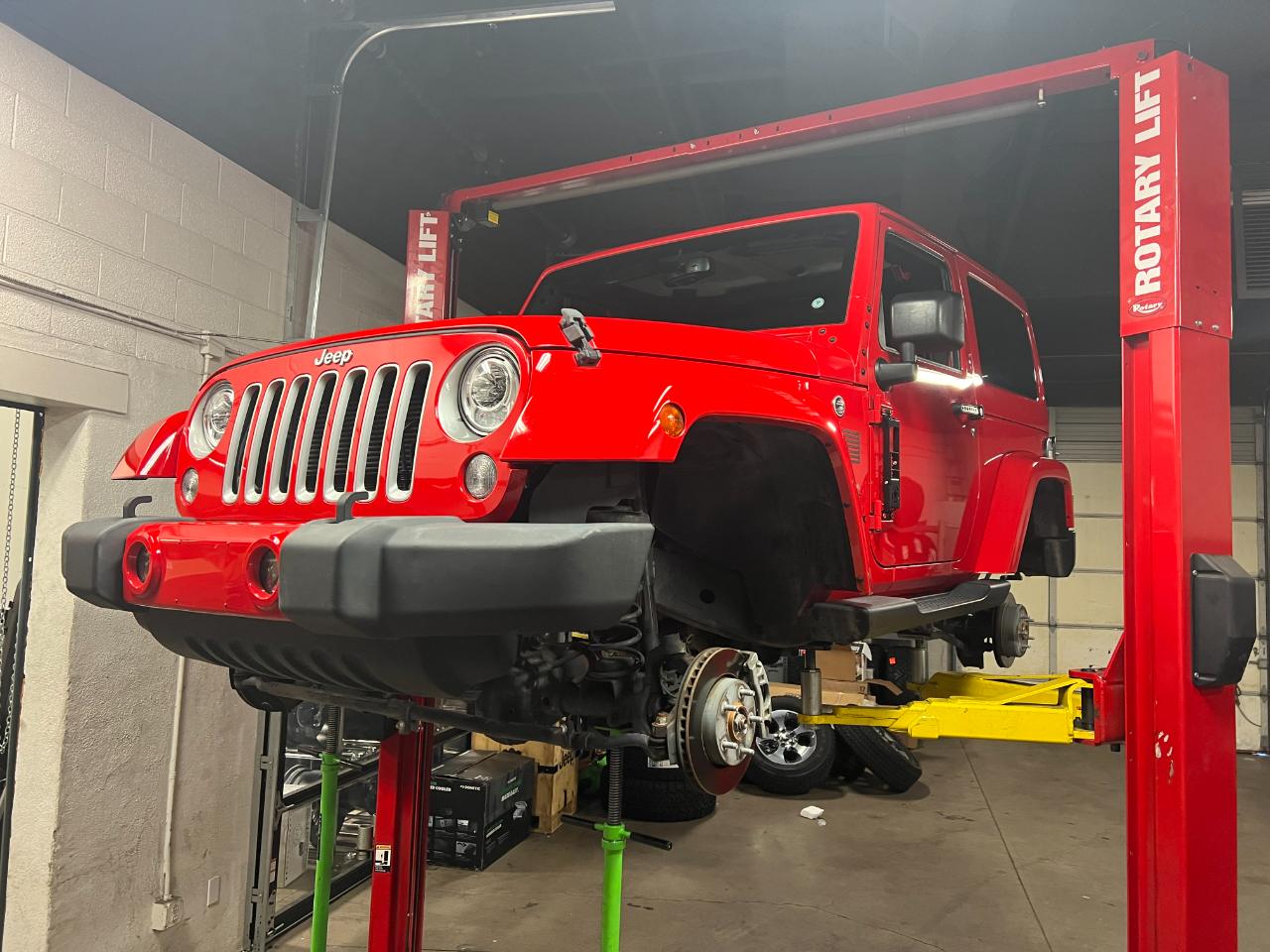 On the lift — Outlaw Jeep and Truck