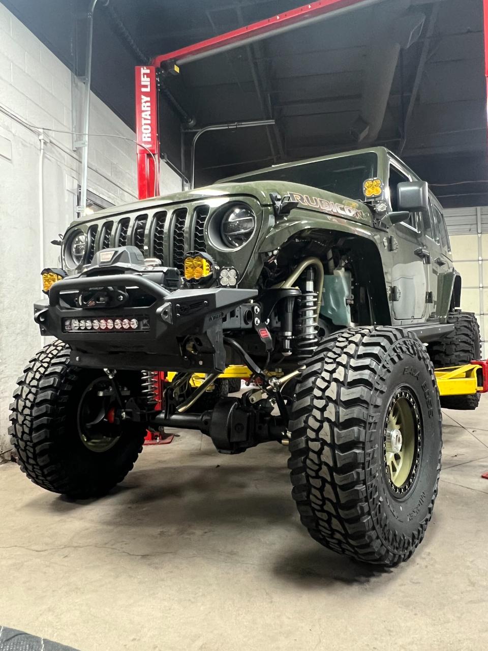 On the lift — Outlaw Jeep and Truck